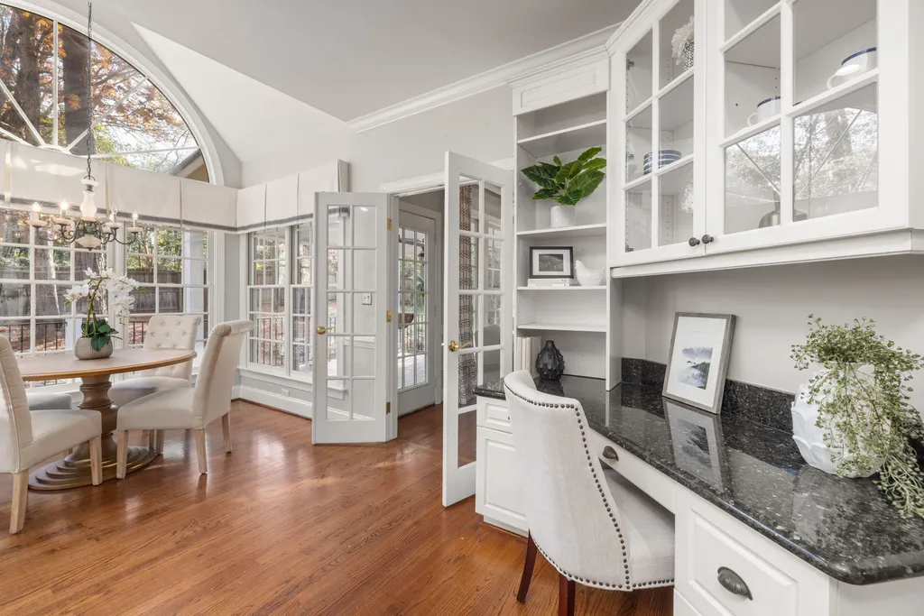 A well-organized home interior showing safe plants placed on high shelves and in hanging baskets, with a content dog lying on a dog bed far away from the greenery